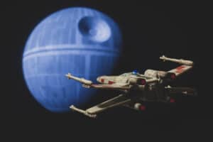 Star Wars A New Hope with a Rebel X Wing fighter approaching the Death Star